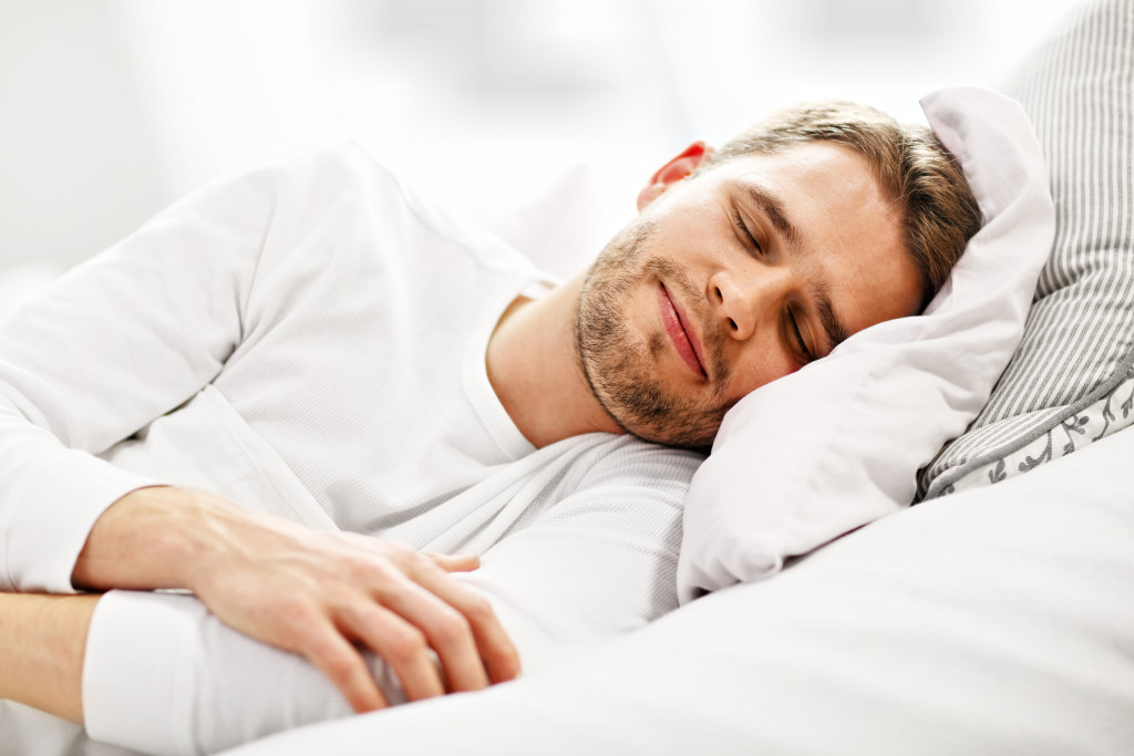 man sleeping with a smile