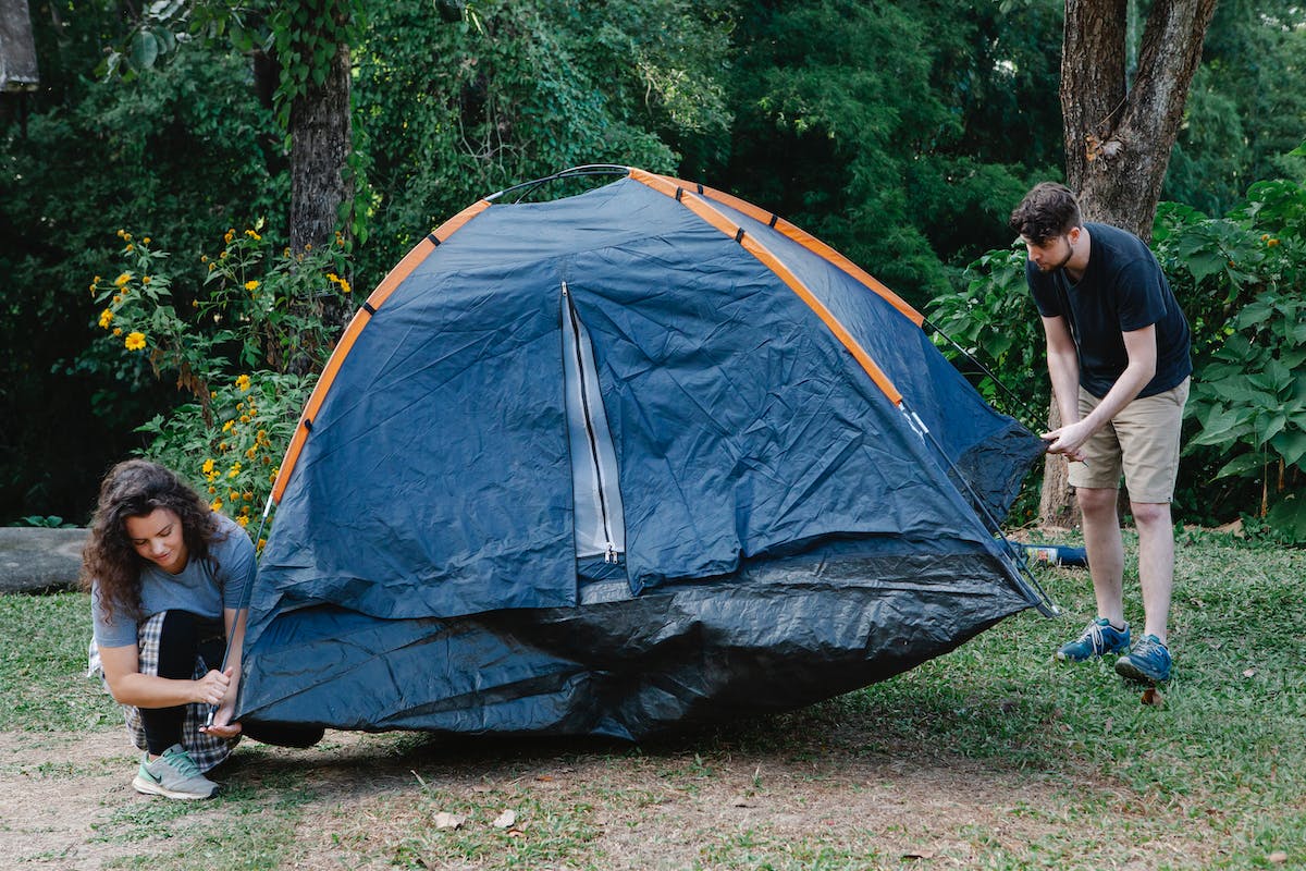 couple setting up their tent